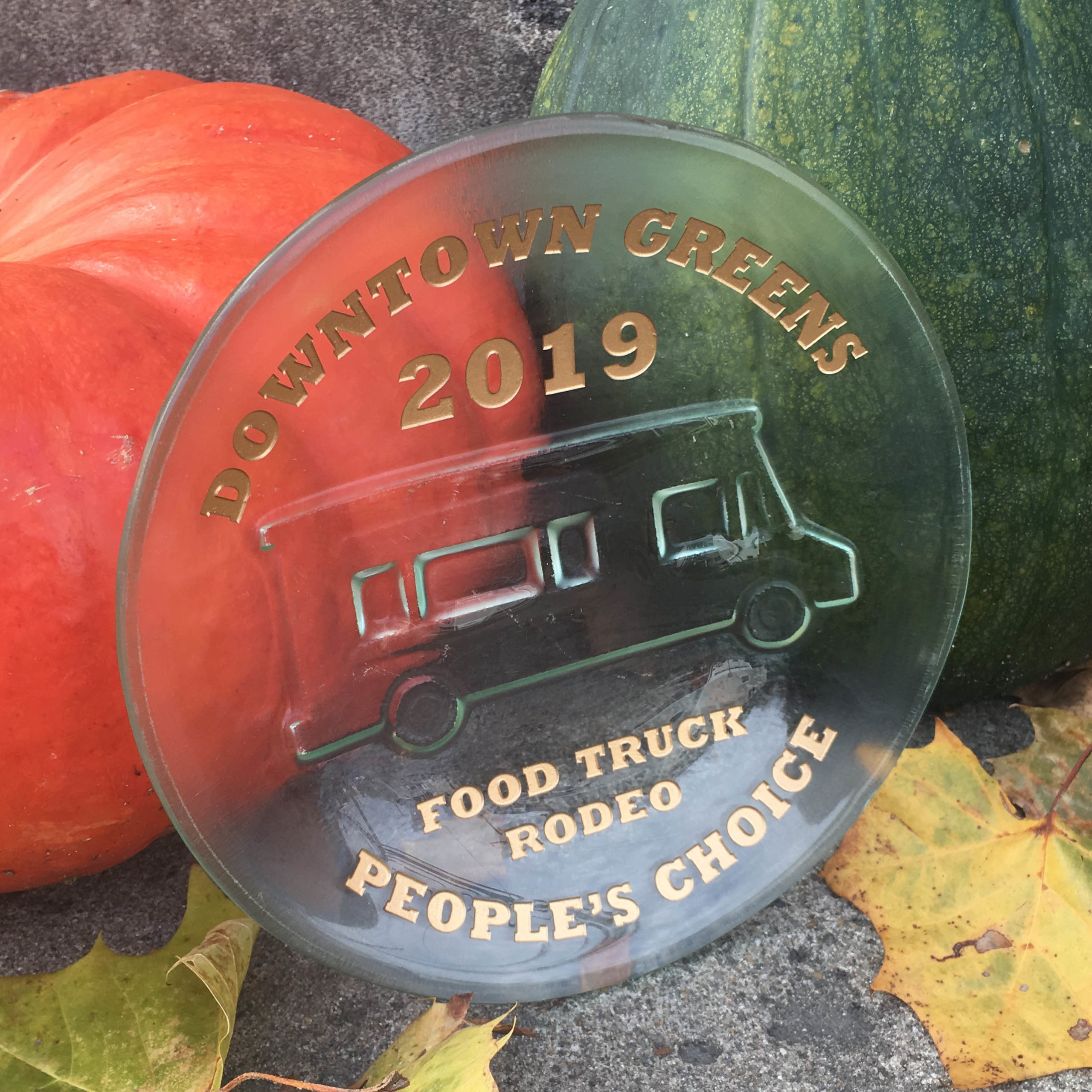 Glass dish with embossed design of a food truck with the text "food truck rodeo people's choice award, 2019"